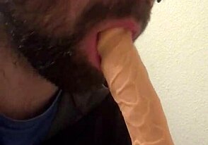 Young gay guy tries out a dildo alone