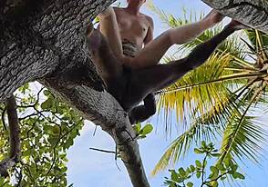 My lover makes love to me in the ass while standing on a high tree stump