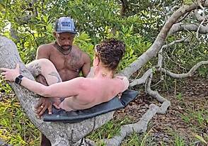My lover makes love to me in the ass while standing on a high tree stump
