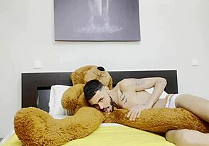 A femboy and a bear have fun with a gay blowjob and anal sex