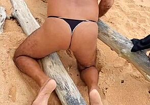 Single African American gay twink shows off his ass in panties at the beach