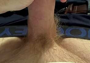 A guy with a ginger beard deals with a leaky faucet