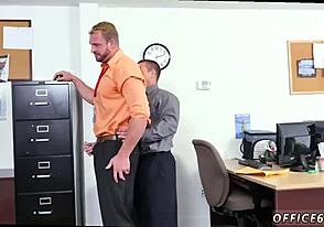 Muscular men engaging in anal sex