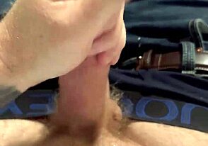 A guy with a ginger beard deals with a leaky faucet