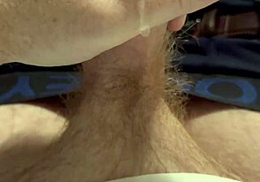 A guy with a ginger beard deals with a leaky faucet