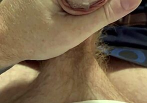 A guy with a ginger beard deals with a leaky faucet