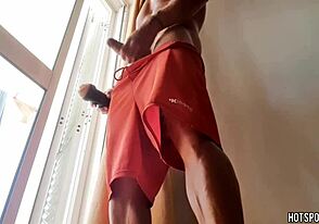 Masturbating sexy guy: A risky thrill at the window