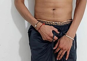Gay guy masturbates his uncut cock