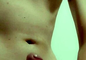 Young guy masturbates his juicy cock in his twink solo video
