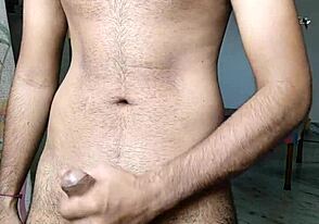 Hairy Indian guy in hotel room, pleasuring himself with a finger