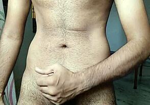 Hairy Indian guy in hotel room, pleasuring himself with a finger