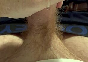 A guy with a ginger beard deals with a leaky faucet